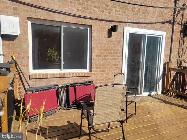 a kitchen with stainless steel appliances granite countertop a refrigerator a stove and a sink