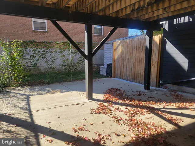 a living room with furniture a air conditioner vent and a rug