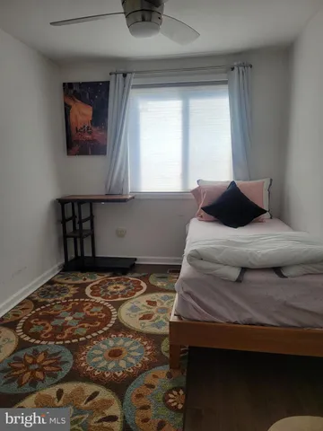 a bedroom with a bed and a table in it