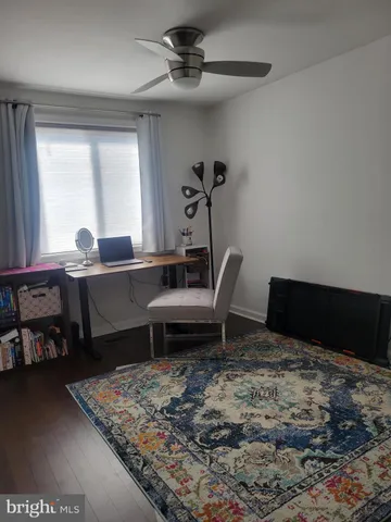 a view of a livingroom with wooden floor