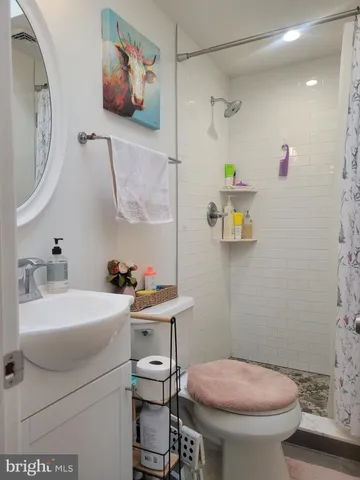 a bedroom with a bed and a fireplace