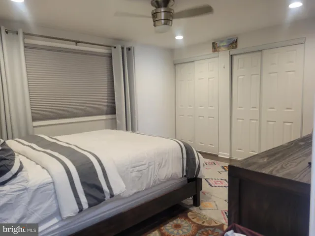 a view of a patio with table and chairs with wooden floor and fence