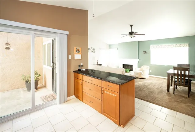 a kitchen with stainless steel appliances granite countertop a sink and a stove