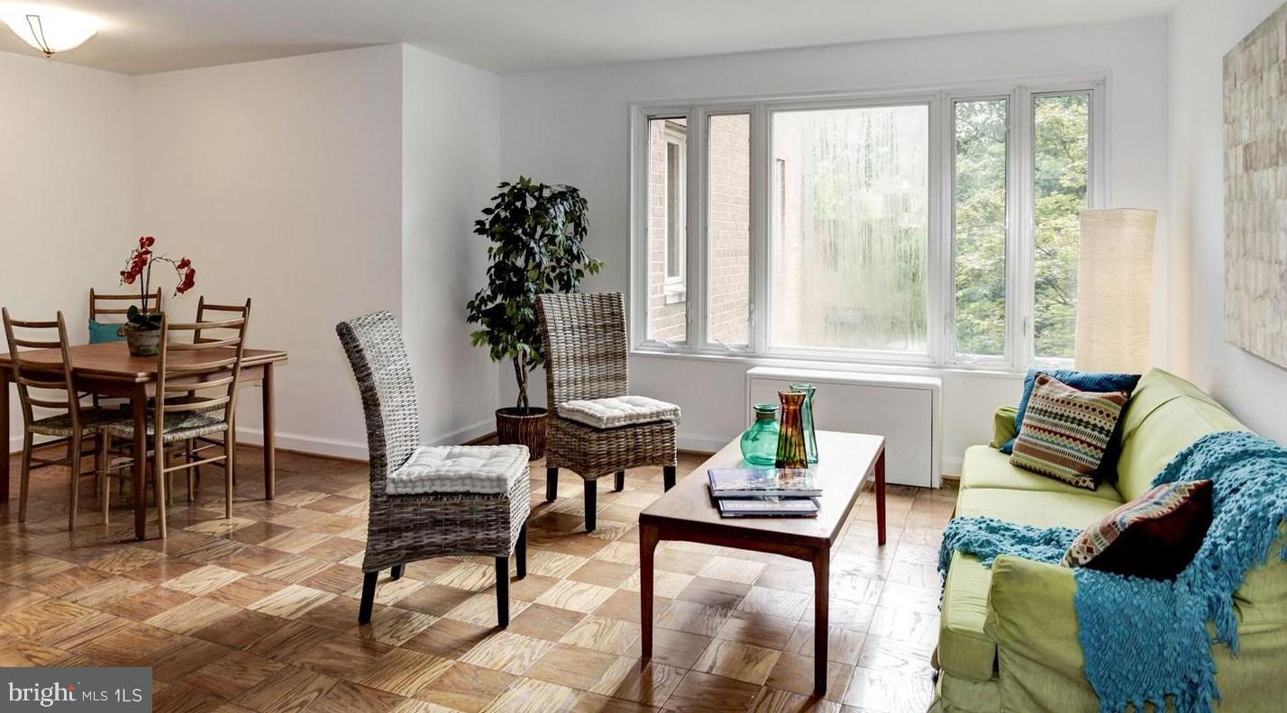 2400 41st Street Northwest, Unit 203 Washington, DC 20007 - Photo 11 of 24 a living room with furniture and a potted plant
