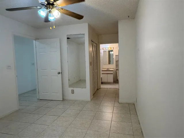 a view of closet and bathroom