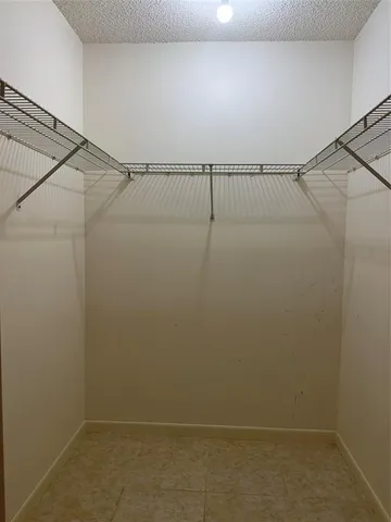 an empty room with mirror