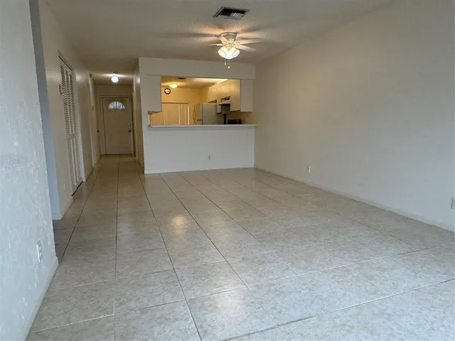 a kitchen with stainless steel appliances a sink stove and refrigerator