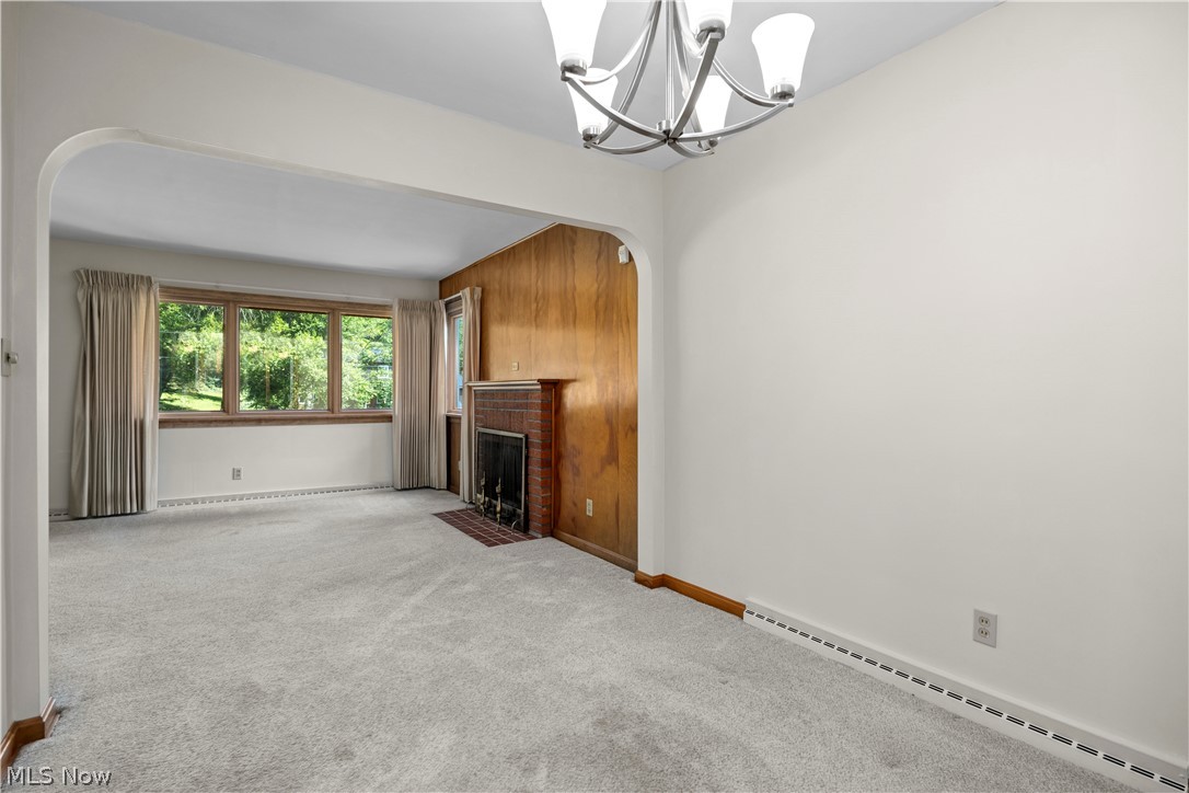 1740 Walnut Road Kent, OH 44240 - Photo 10 of 43 Light gray carpet flooring extending through an arched entryway