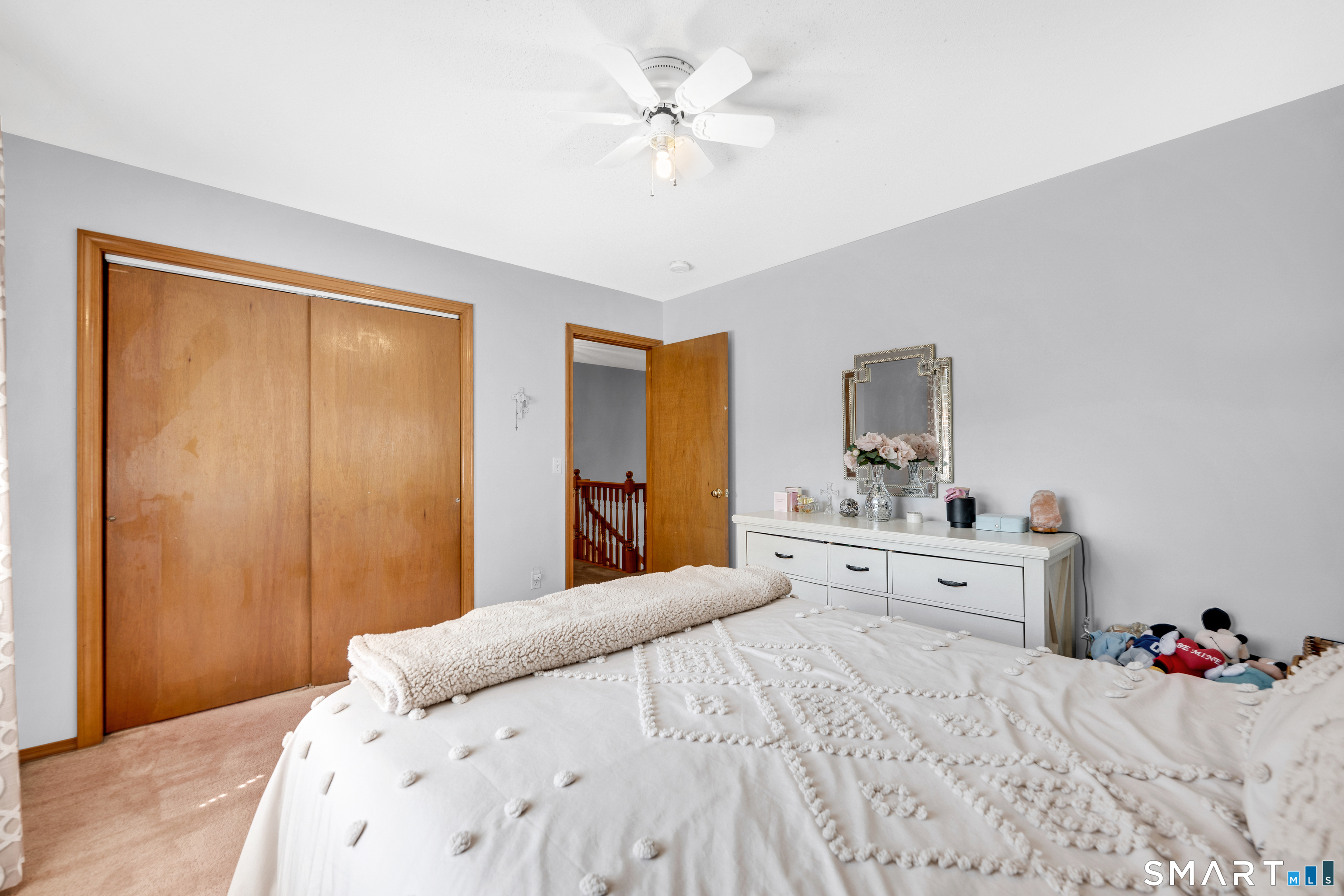 89 Windsorville Road South Windsor, CT 06074 - Photo 9 of 23 a bedroom with a bed and a chandelier