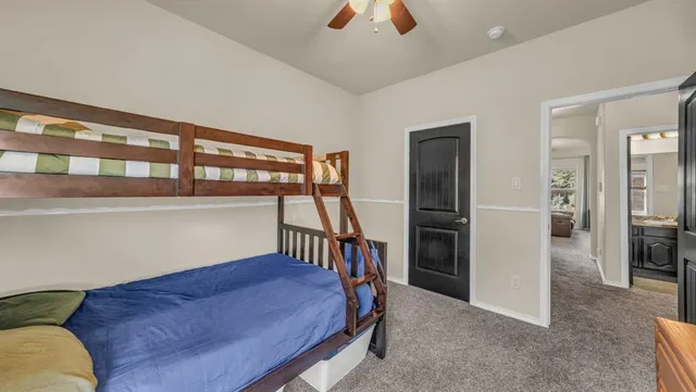 a bedroom with furniture and a window