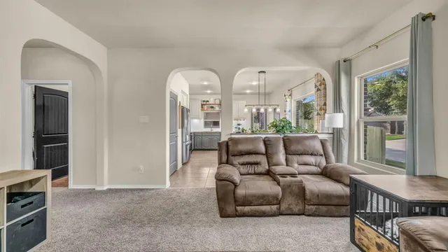 a living room with furniture and a window