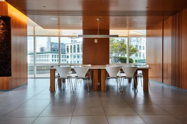 a view of a dining room with furniture window and outside view