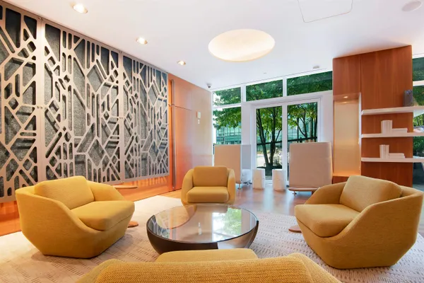 a view of a swimming pool with sitting area