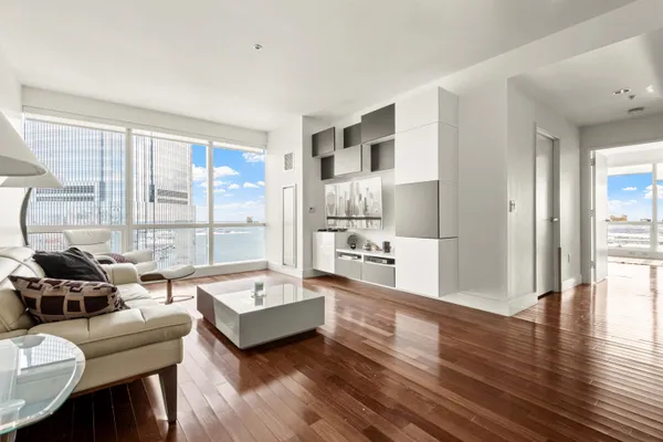 a living room with furniture and a large window