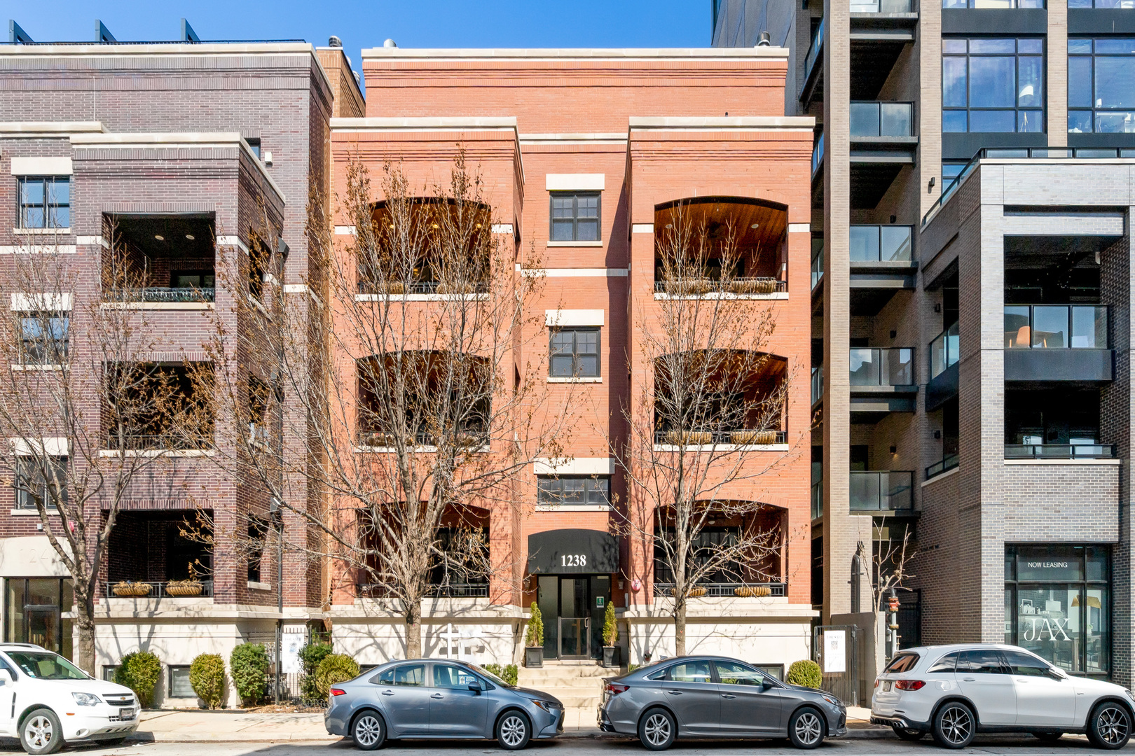a view of a car parked in front of a building