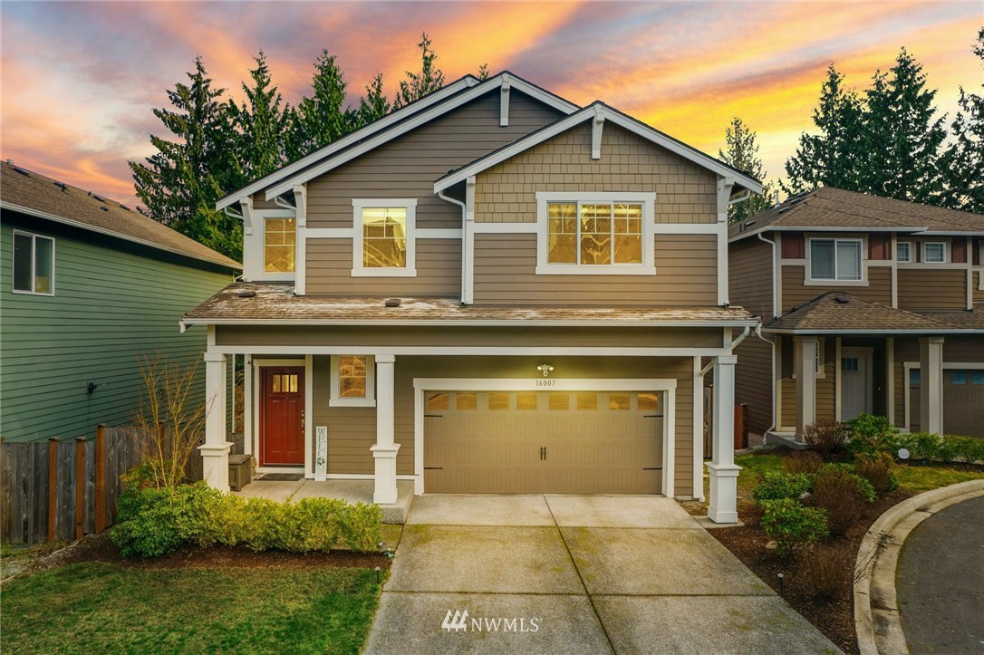 16007 Meridian Avenue South Bothell, WA 98012 - Photo 1 of 35 a front view of a house with garden