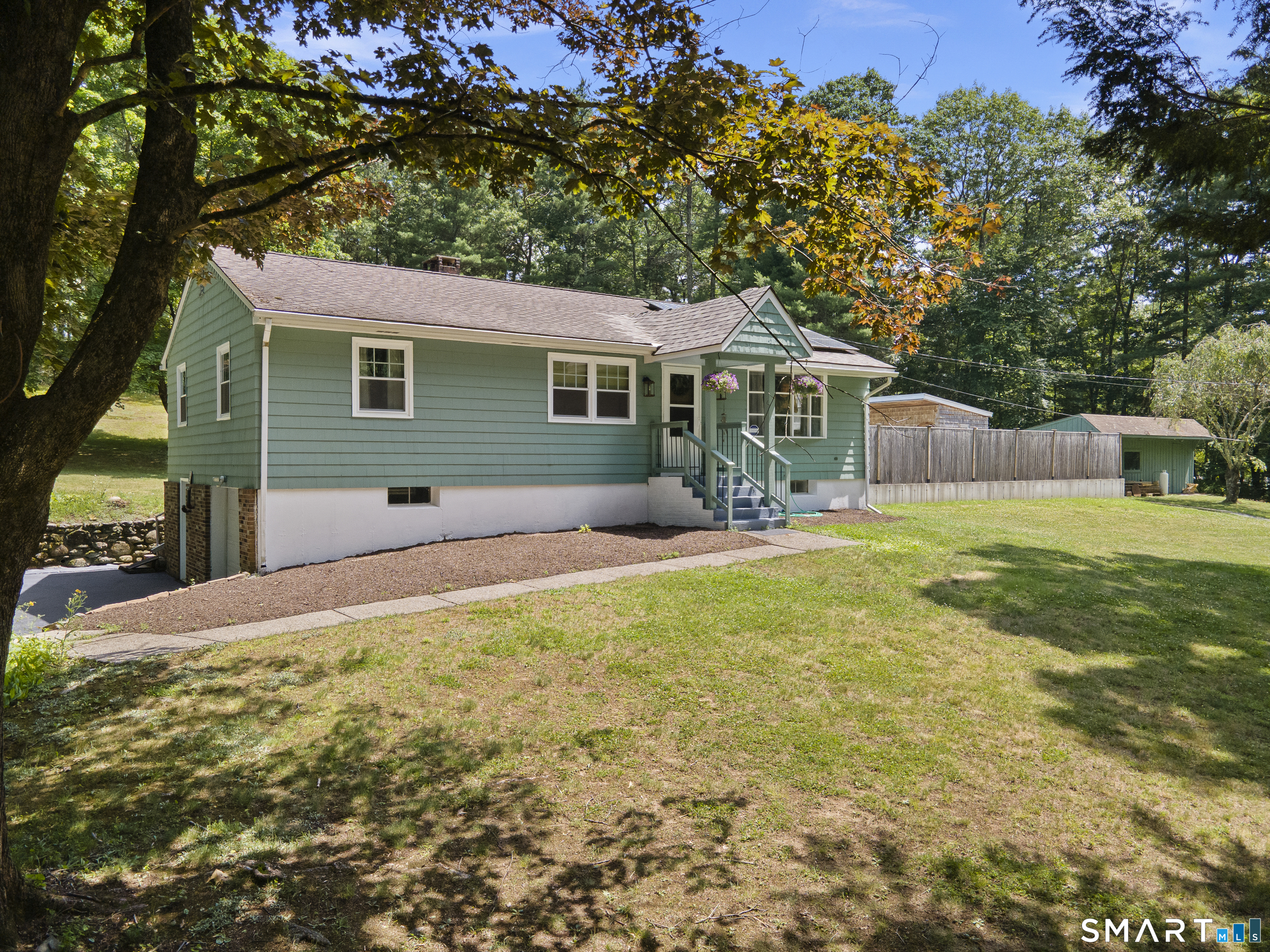 11 Munyan Road Putnam, CT 06260 - Photo 2 of 33 a front view of house with yard and green space