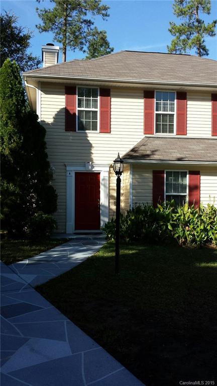 6729 Bevington Ridge Road, Unit A Charlotte, NC 28277 - Photo 2 of 12 a front view of a house with a garden