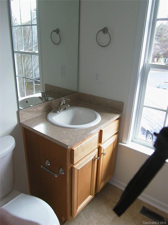 6729 Bevington Ridge Road, Unit A Charlotte, NC 28277 - Photo 11 of 12 a bathroom with a sink and a toilet