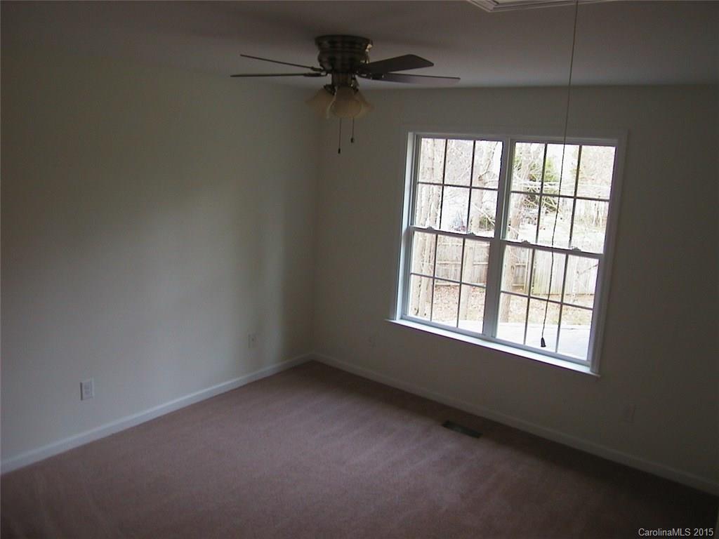 6729 Bevington Ridge Road, Unit A Charlotte, NC 28277 - Photo 12 of 12 an empty room with a window