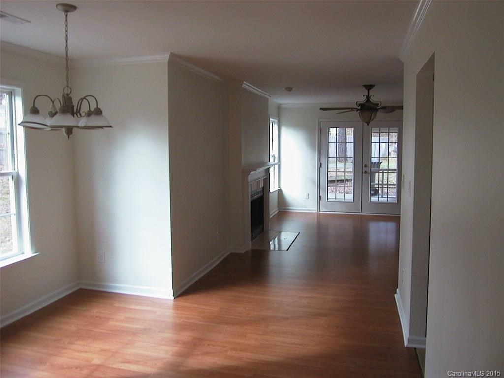 6729 Bevington Ridge Road, Unit A Charlotte, NC 28277 - Photo 3 of 12 a view of a room with wooden floor and windows