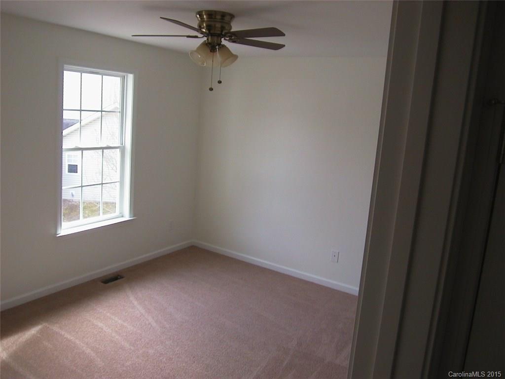 6729 Bevington Ridge Road, Unit A Charlotte, NC 28277 - Photo 9 of 12 an empty room with a window