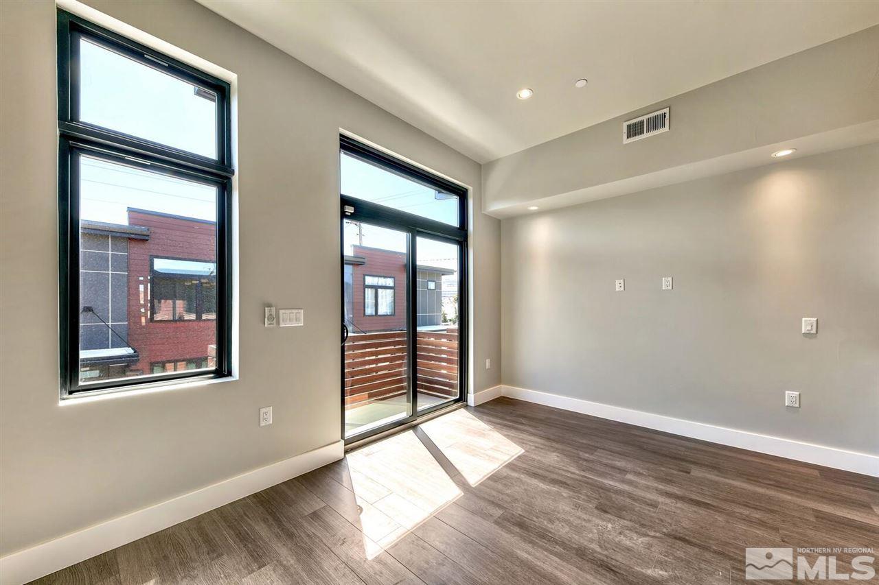 504 Mill Street Reno, NV 89502 - Photo 13 of 22 a view of empty room with wooden floor and fan