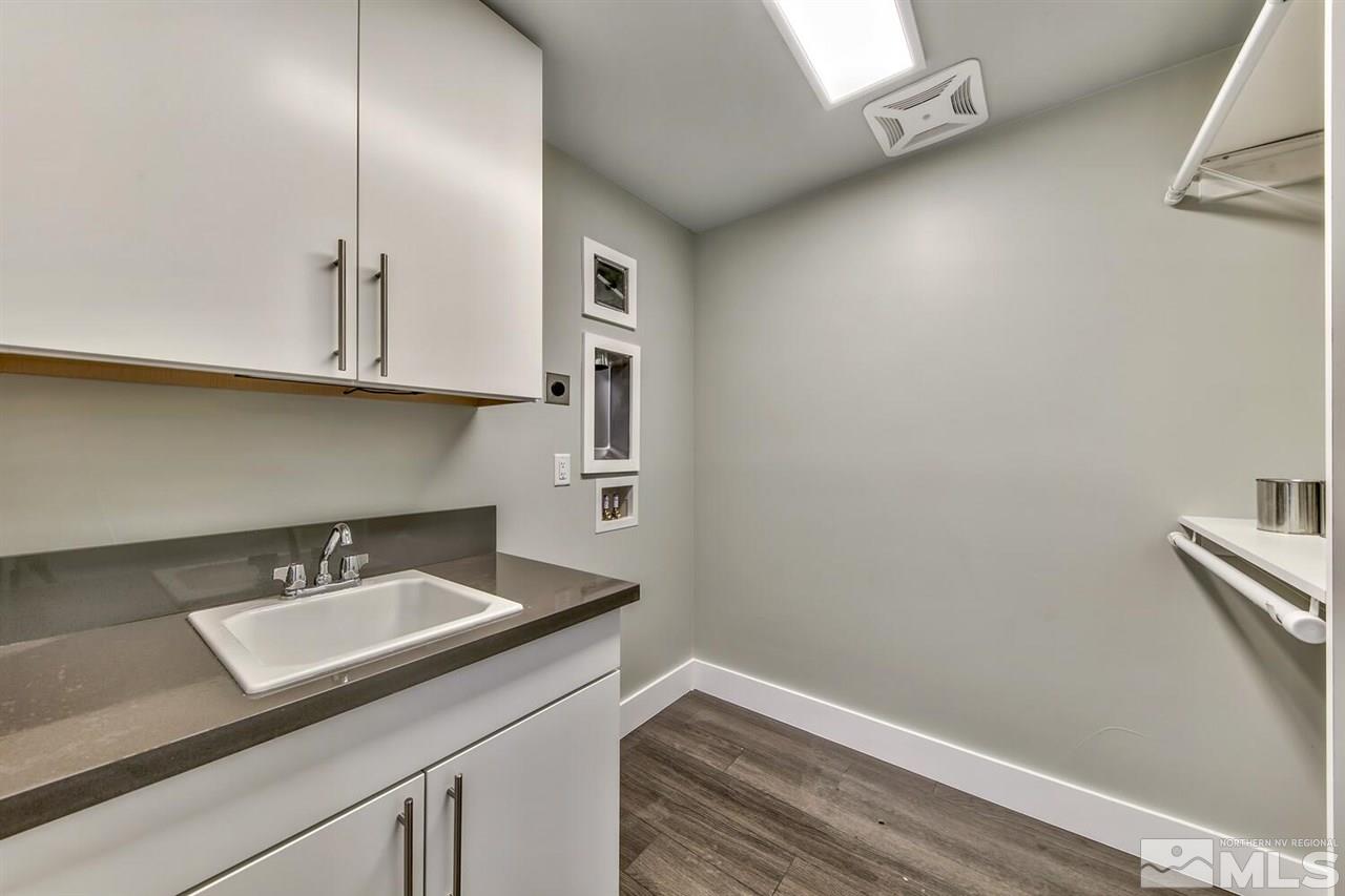 504 Mill Street Reno, NV 89502 - Photo 16 of 22 a bathroom with a sink and a mirror