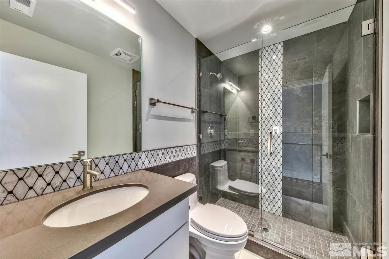504 Mill Street Reno, NV 89502 - Photo 9 of 22 a bathroom with a sink toilet and shower