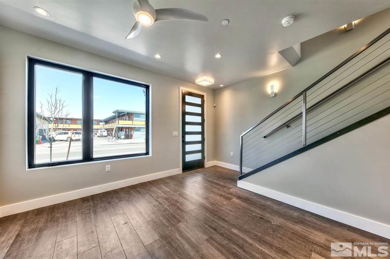 504 Mill Street Reno, NV 89502 - Photo 10 of 22 a view of an empty room with wooden floor and a window