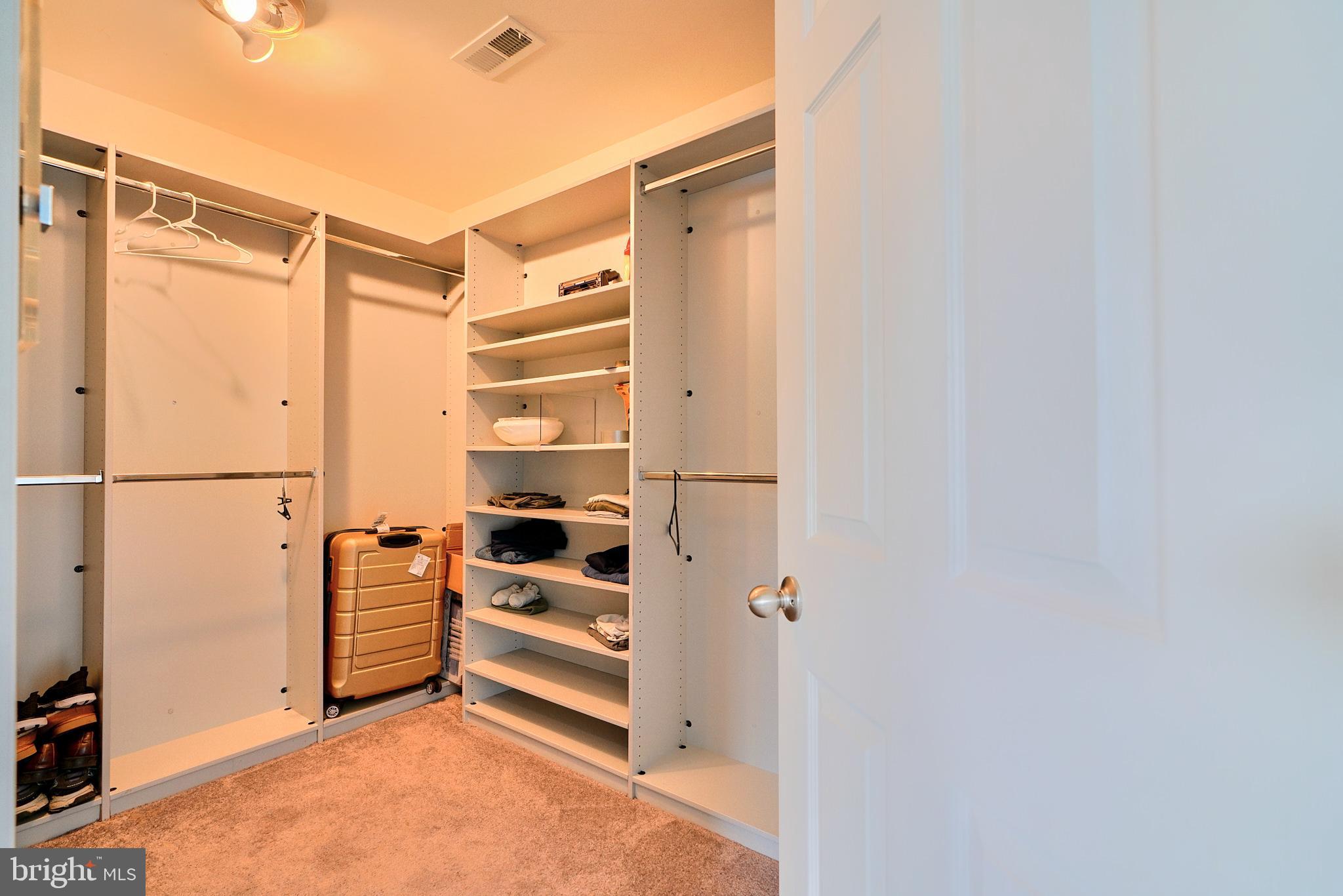 709 Middle River Road Middle River, MD 21220 - Photo 21 of 50 a view of walk in closet with clothes and shoes