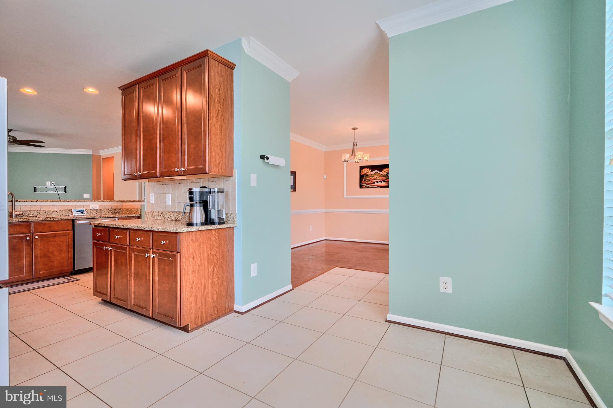 709 Middle River Road Middle River, MD 21220 - Photo 9 of 50 a kitchen with stainless steel appliances granite countertop a refrigerator and a sink