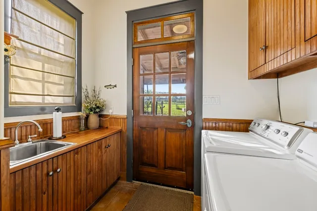 a kitchen with stainless steel appliances granite countertop a sink and cabinets