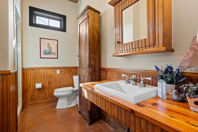 a bed room with a bed and a window