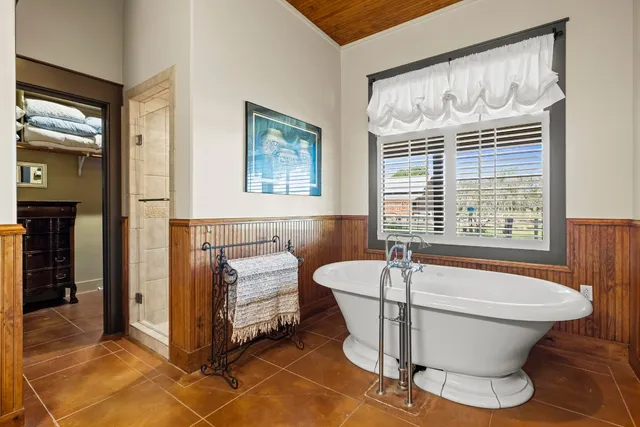 a bathroom with a sink a mirror and a shower