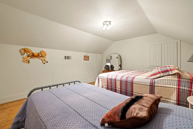 a room with pool table and windows