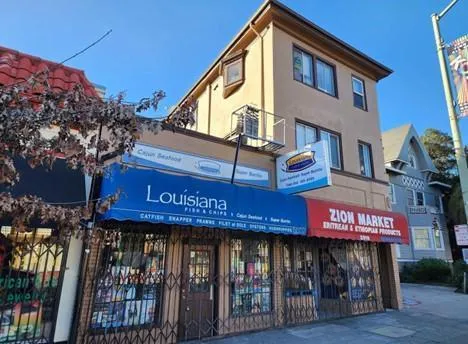 a view of a cafe with sitting area