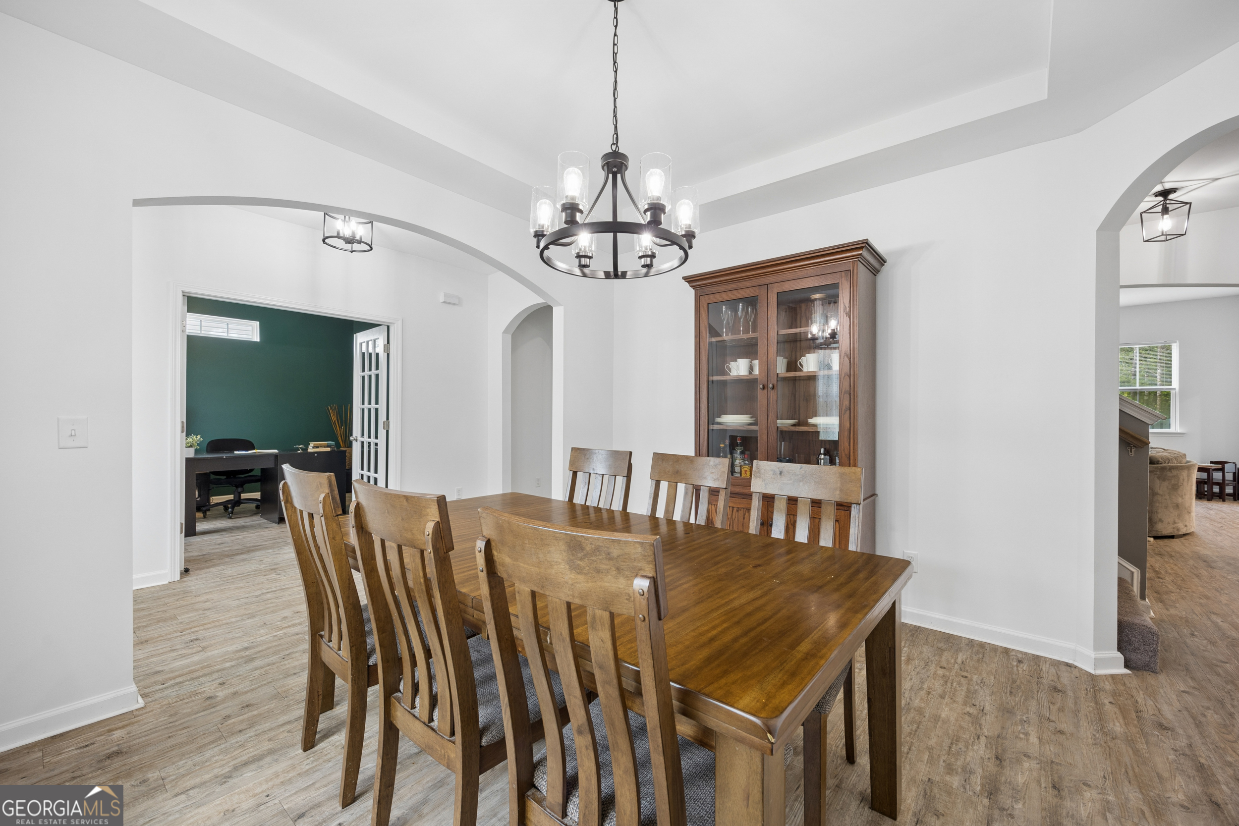 369 Waybridge Way Richmond Hill, GA 31324 - Photo 24 of 40 a view of a dining room with furniture and wooden floor