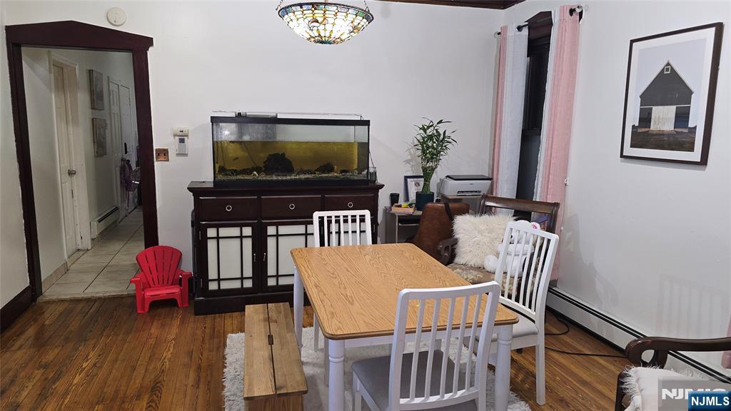 106 Knapp Avenue Clifton, NJ 07011 - Photo 4 of 7 a view of a dining room with furniture and wooden floor