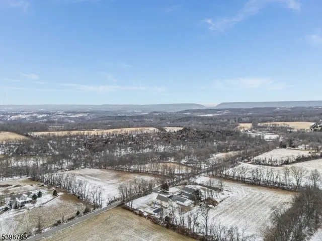 an aerial view of residential house and ocean