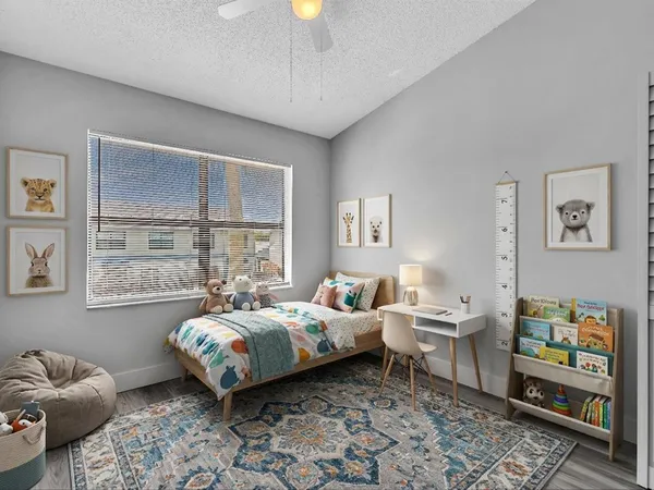 a bed room with a bed and a window
