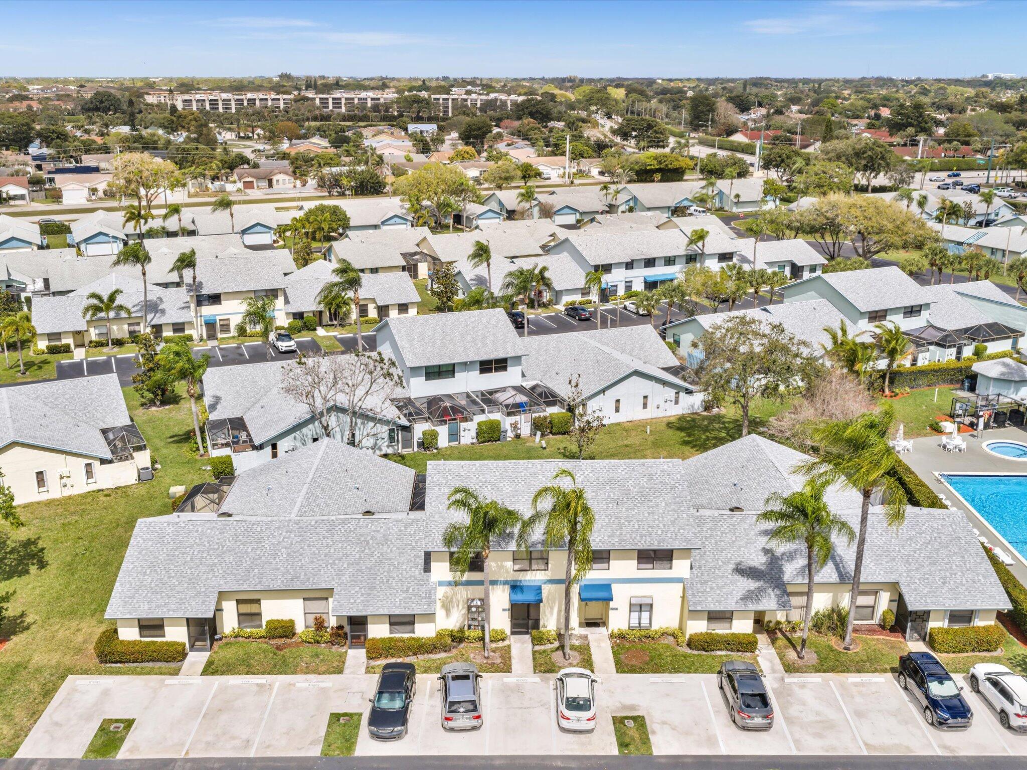 9095 Southwest 21st Court, Unit D Boca Raton, FL 33428 - Photo 31 of 36 an aerial view of residential houses with outdoor space