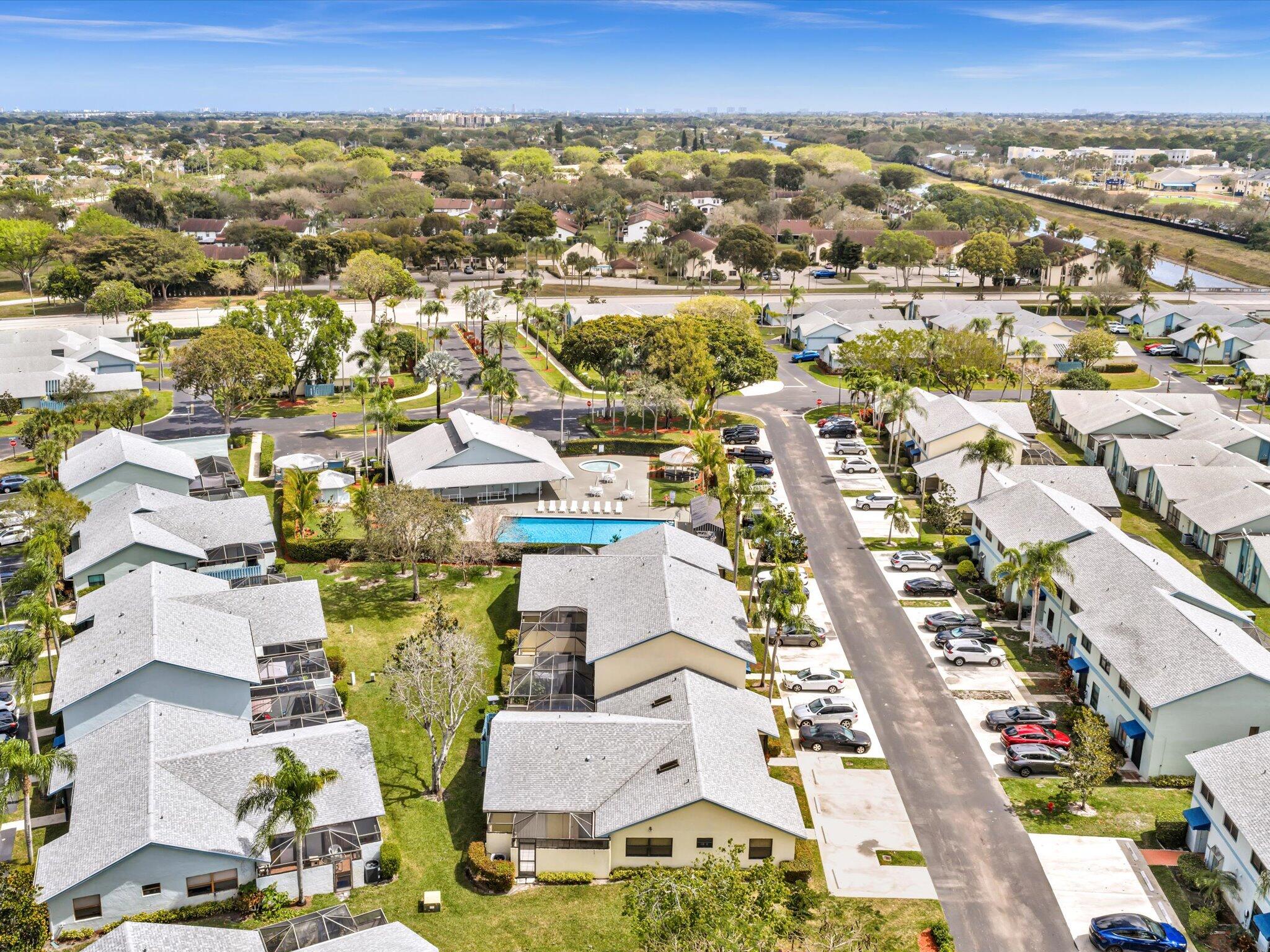 9095 Southwest 21st Court, Unit D Boca Raton, FL 33428 - Photo 32 of 36 an aerial view of residential building with parking