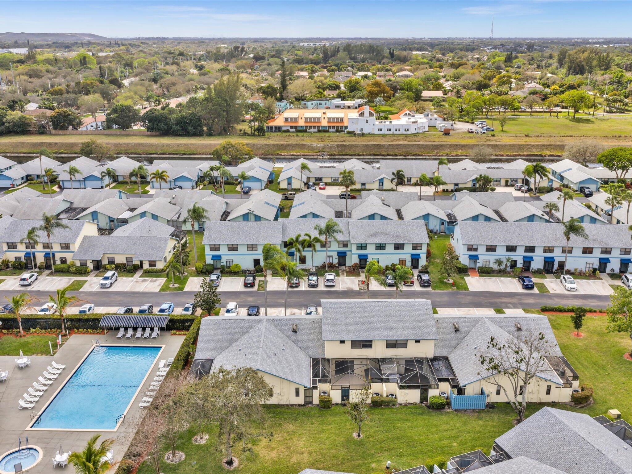 9095 Southwest 21st Court, Unit D Boca Raton, FL 33428 - Photo 33 of 36 an aerial view of residential houses with outdoor space
