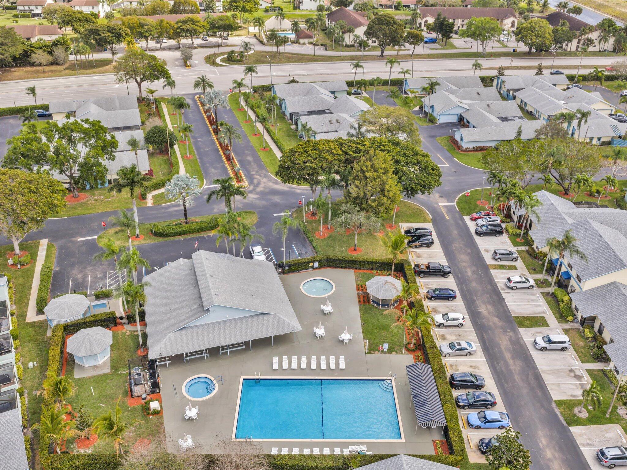 9095 Southwest 21st Court, Unit D Boca Raton, FL 33428 - Photo 34 of 36 an aerial view of residential houses with outdoor space