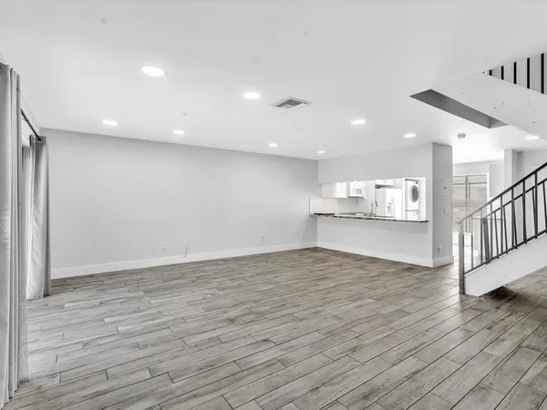 a view of kitchen and wooden floor