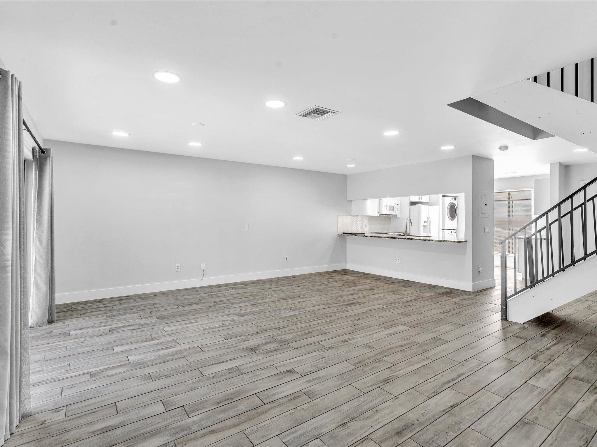 9095 Southwest 21st Court, Unit D Boca Raton, FL 33428 - Photo 9 of 36 a view of kitchen and wooden floor