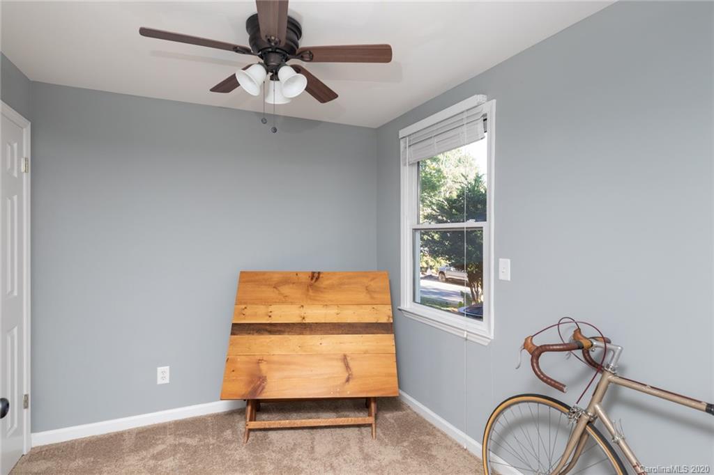 16156 Tana Tea Circle Fort Mill, SC 29708 - Photo 22 of 29 a room with a window and a chandelier