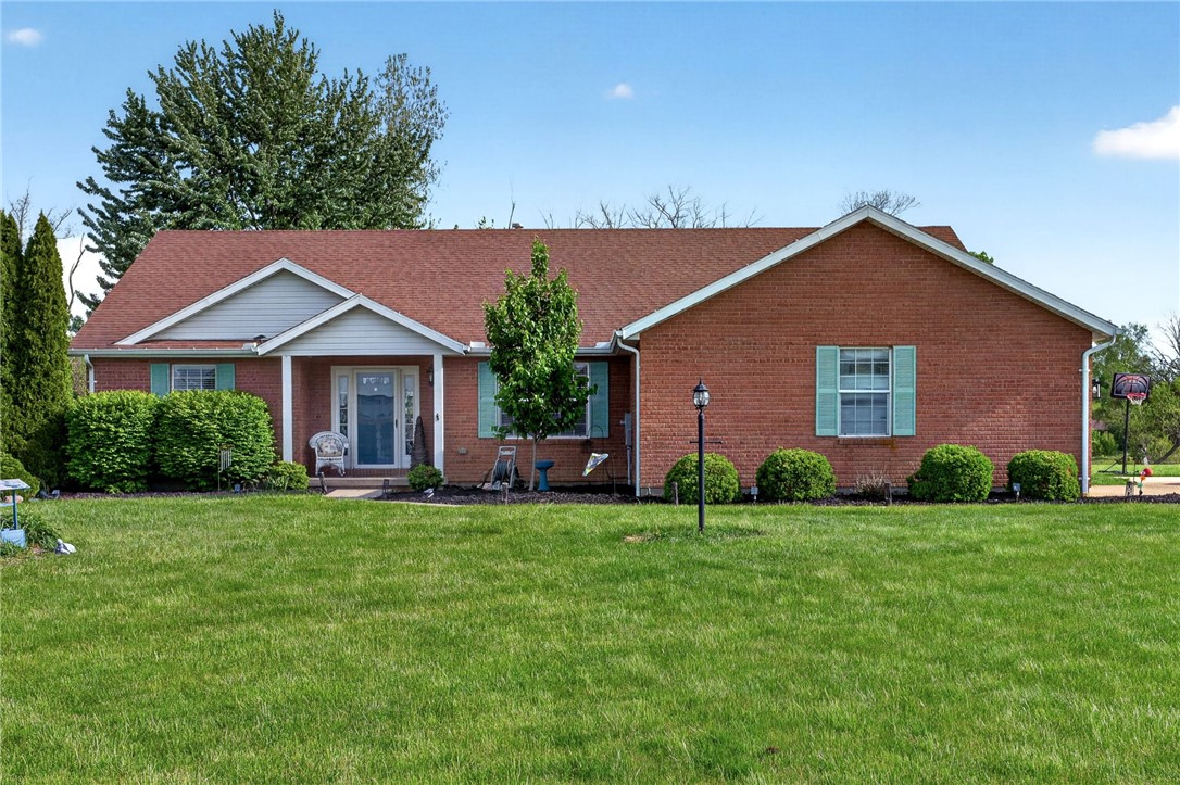 4996 Shannon Avenue Springfield, OH 45504 - Photo 47 of 61 A charming red brick residence with classic shutters offers timeless appeal and a welcoming facade.