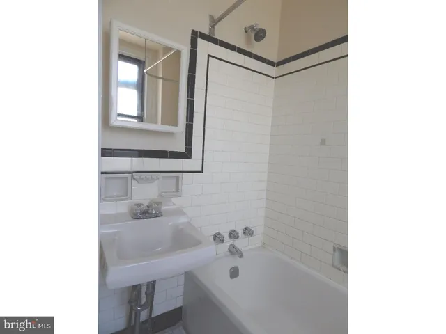 a bathroom with a sink and a bathtub